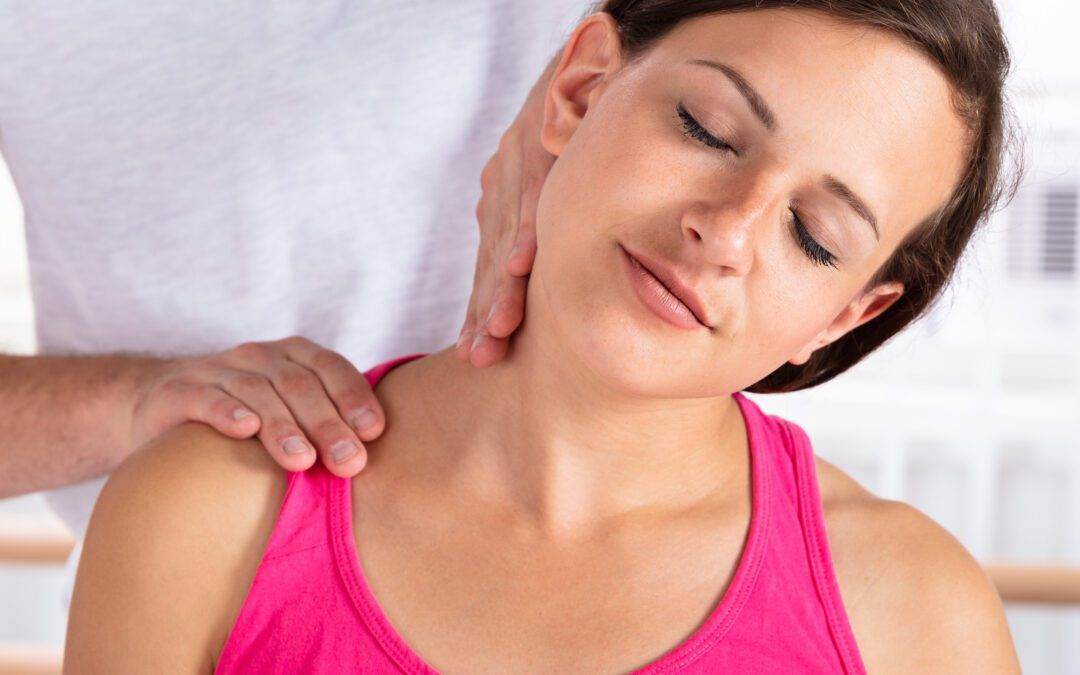 Therapist Massaging Woman's Shoulder