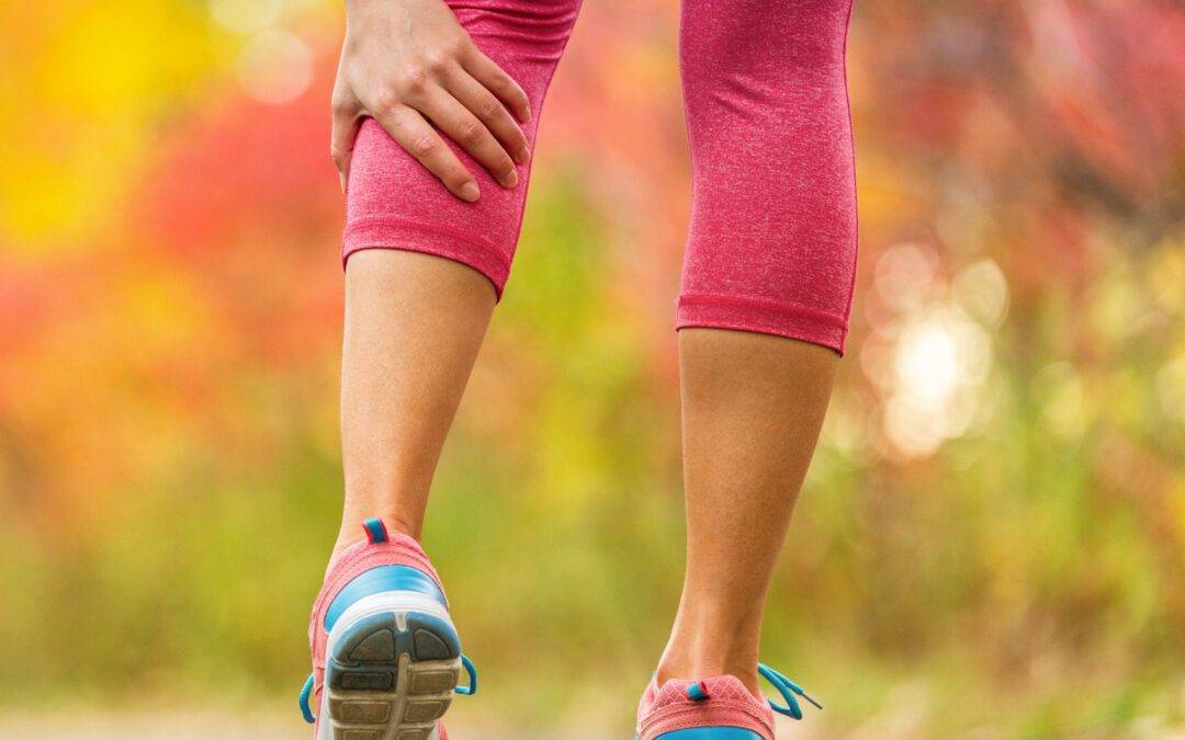 Leg muscle cramp calf sport injury outdoors exercise.