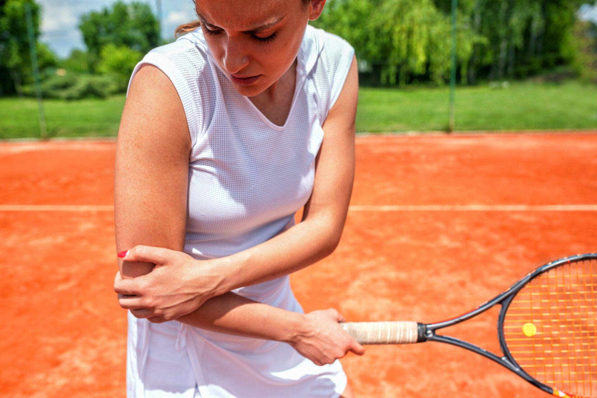 Elbow injury in tennis, unpleasant facial expression