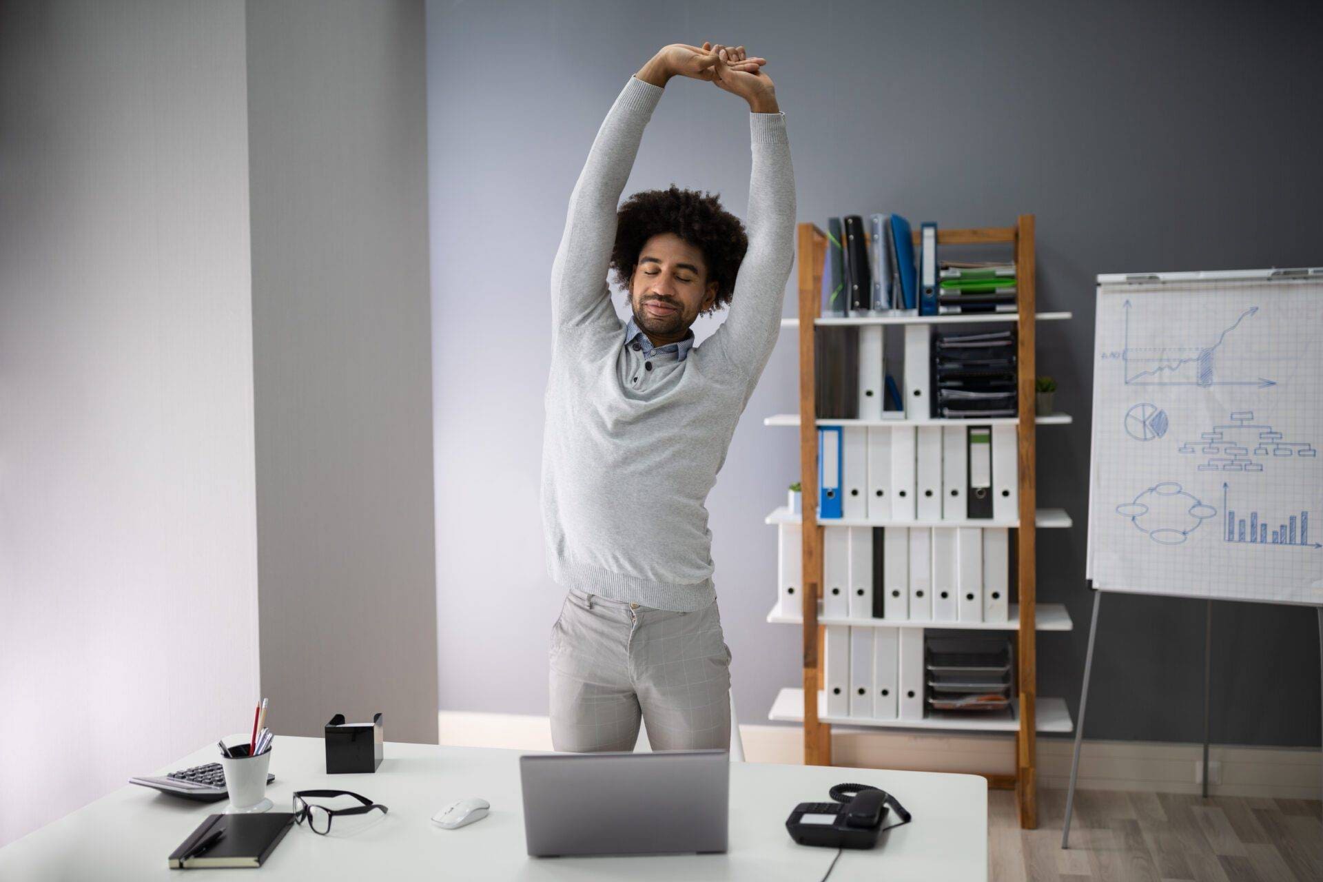 Young Businessman Doing Stretching Exercise
