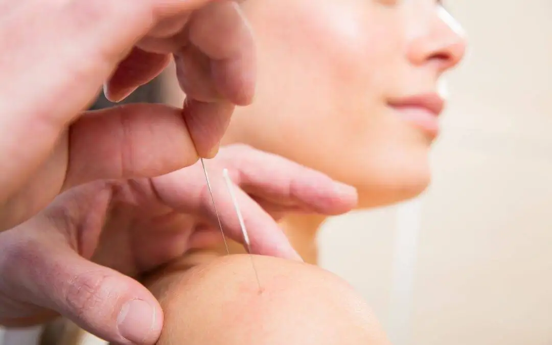 a woman getting a needle from a doctor