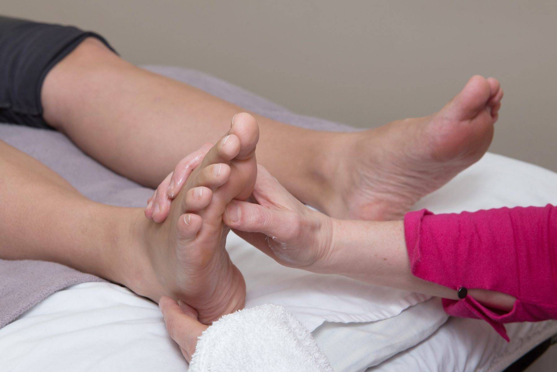 a woman getting a foot massage