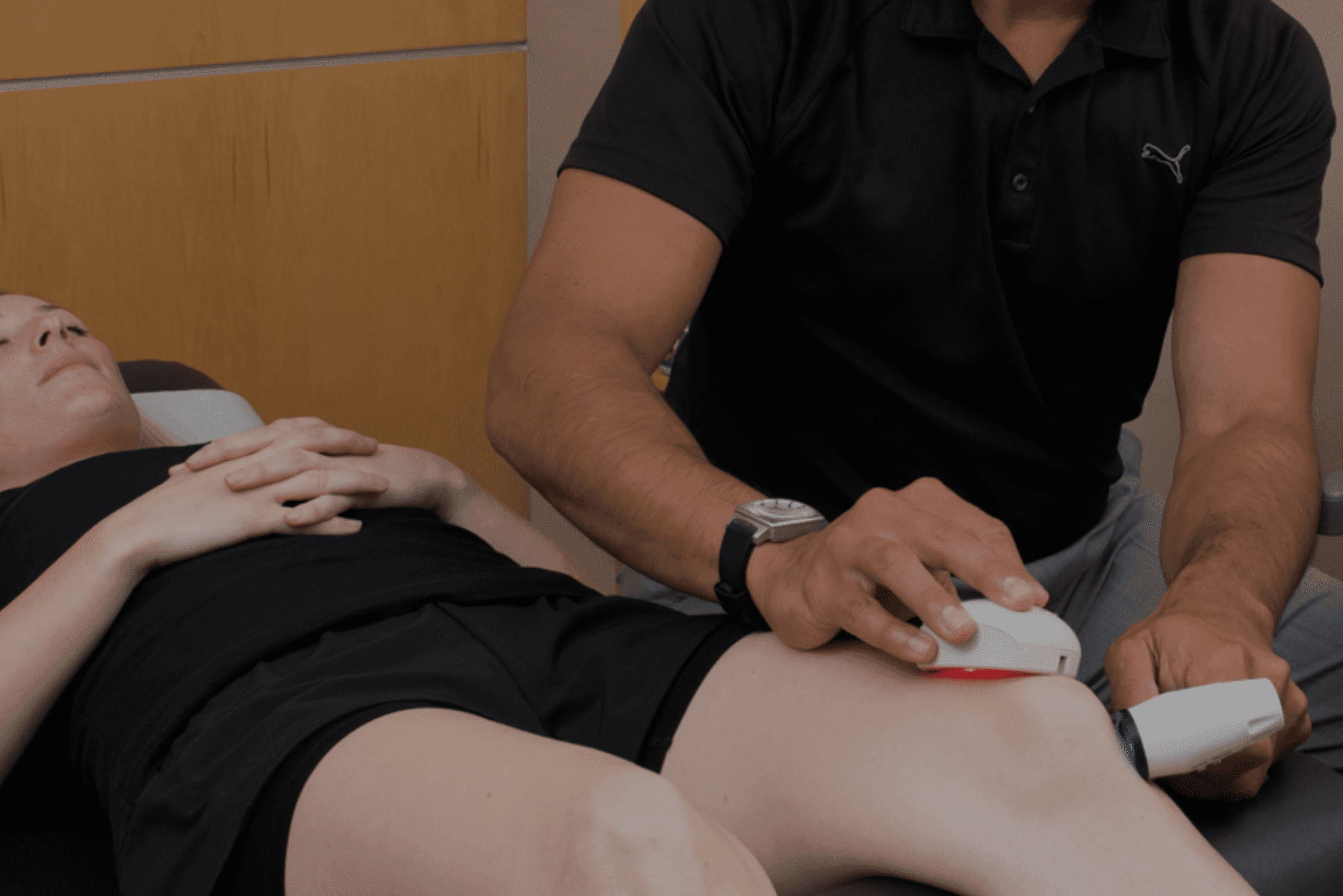 a woman is getting a massage on her knee
