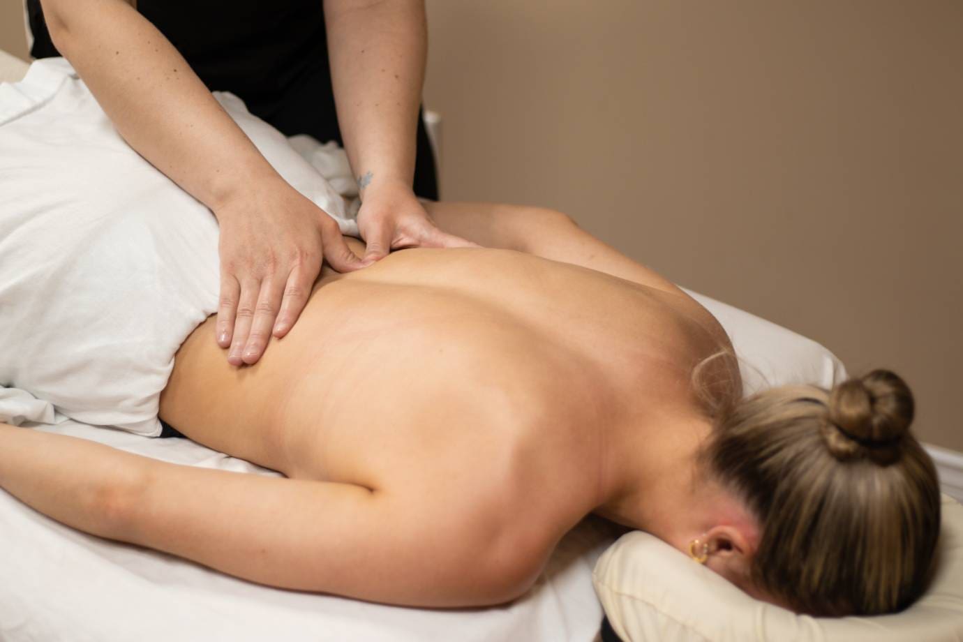 a woman getting a massage in a spa