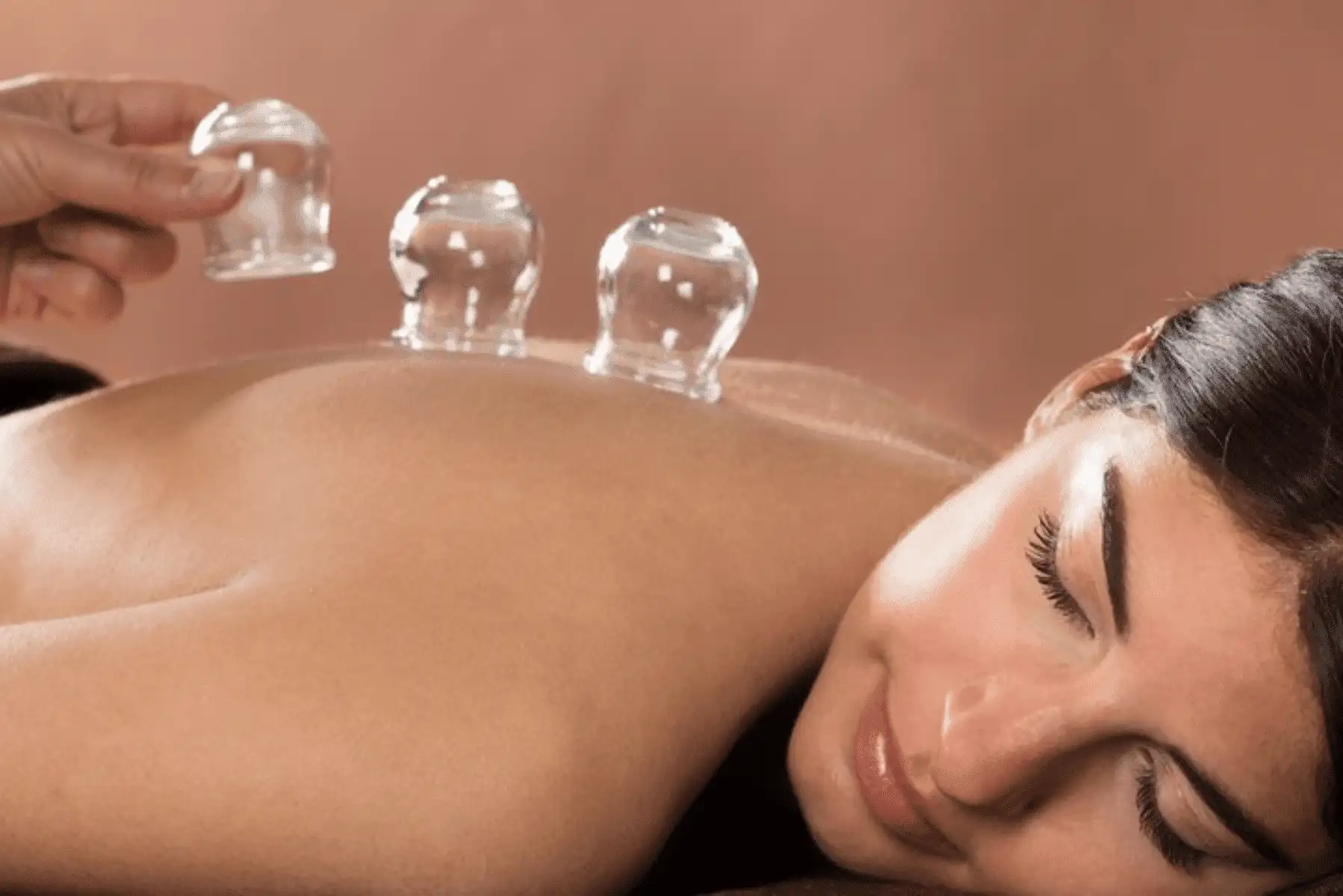 shutterstock_276627362-1000x480 a woman getting a massage with two glass cups