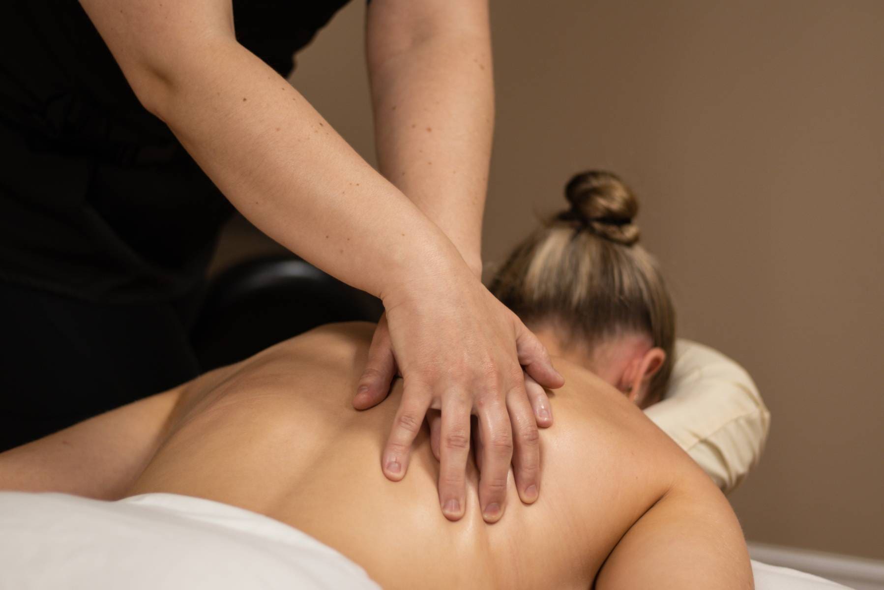 woman getting a massage in a spa